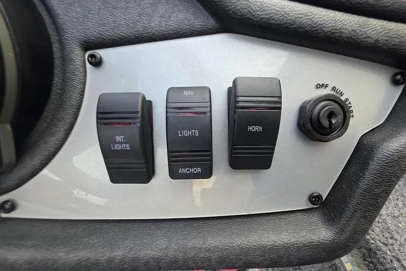 Slide: The Image of Control panel of 2022 Ranger RT188P boat with switches for lights and horn. - 13