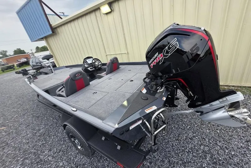 Slide: The Image of 2022 Ranger RT188P boat with Mercury Pro XS engine, parked on gravel near a building. - 7