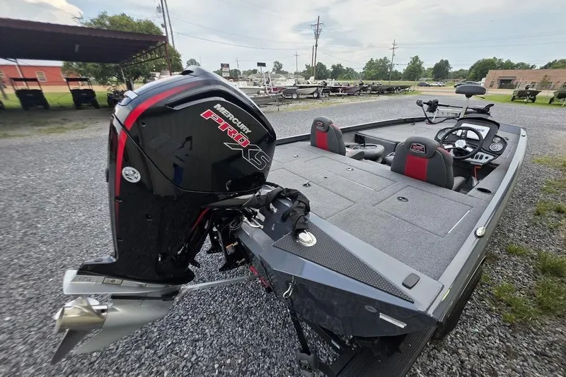 Slide: The Image of 2022 Ranger RT188P boat with Mercury Pro XS engine, parked on gravel lot. - 8