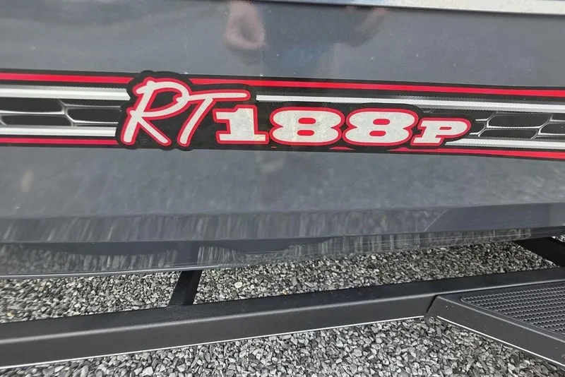 Slide: The Image of 2022 Ranger RT188P boat logo on a dark surface with red and white accents. - 9