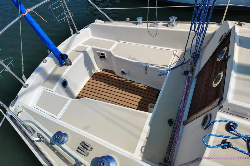 Slide: The Image of 1979 O'Day 28 sailboat cockpit with teak flooring and rigging details. - 12