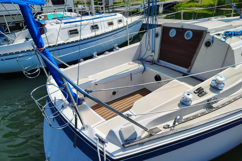 Slide: The Image of 1979 O'Day 28 sailboat docked, showcasing cockpit and rigging details. - 9