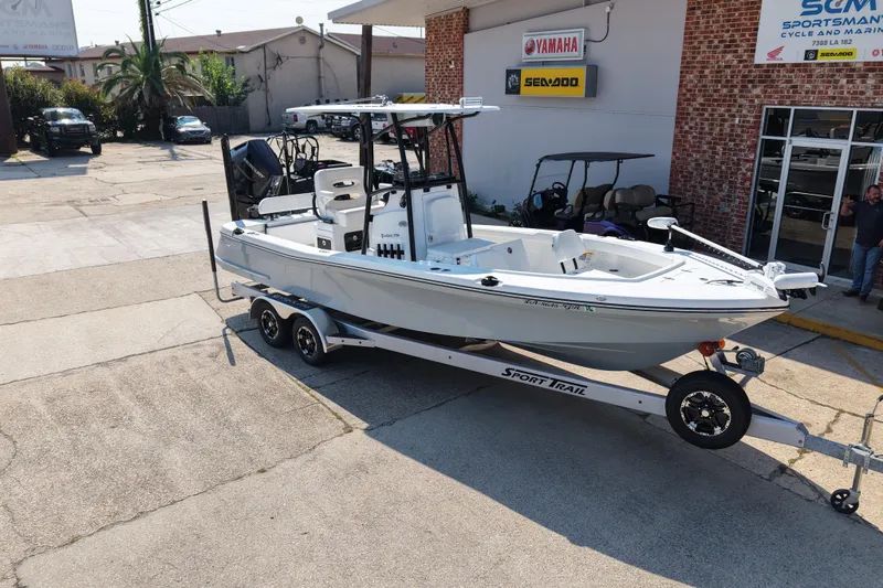 Slide: The Image of 2024 BlackJack 256 Coastal boat on trailer outside dealership. - 6