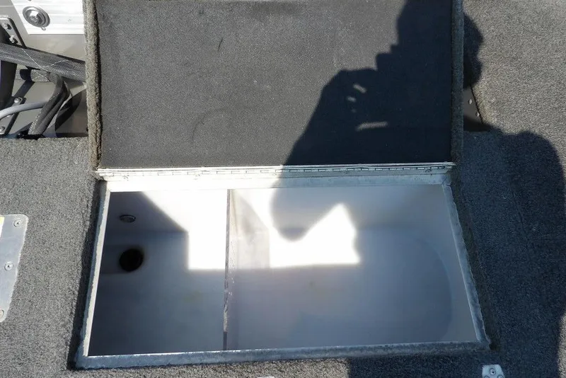 Slide: The Image of Open storage compartment on 2012 Lund 1775 Impact Sport boat. - 12