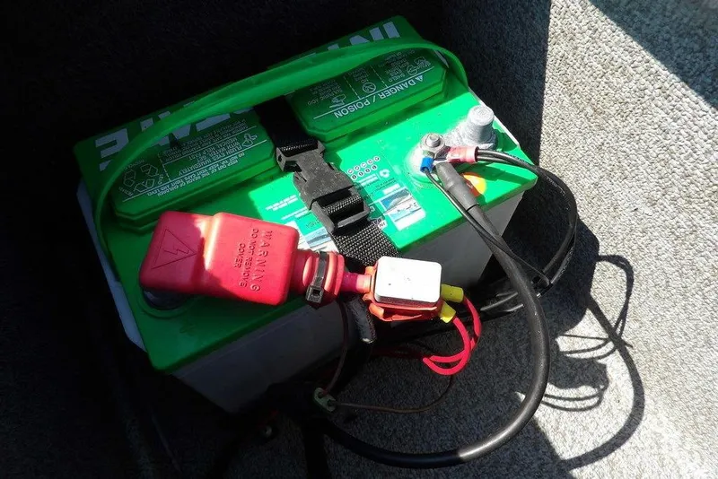 Slide: The Image of Battery installed in a 2012 Lund 1775 Impact Sport boat, secured with straps. - 13