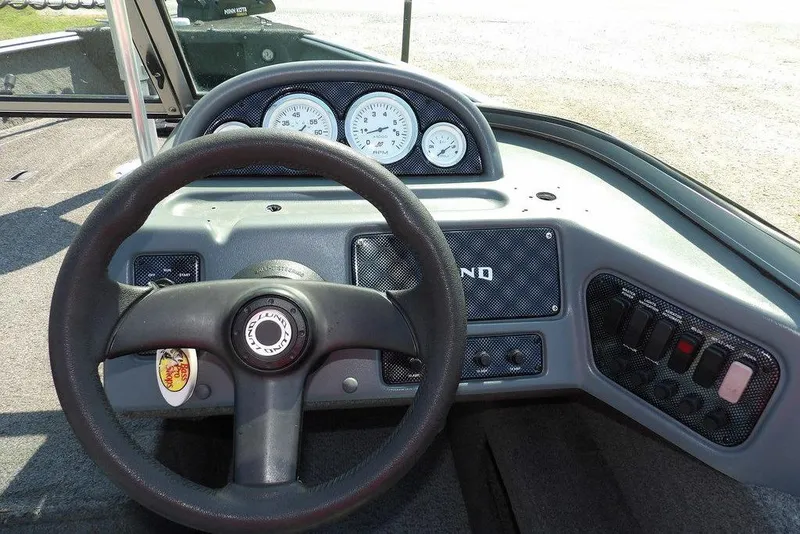 Slide: The Image of Steering console of 2012 Lund 1775 Impact Sport boat with gauges and controls. - 20