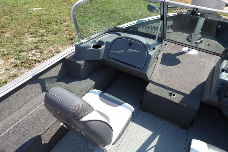 Slide: The Image of 2012 Lund 1775 Impact Sport boat interior with seating and console. - 28