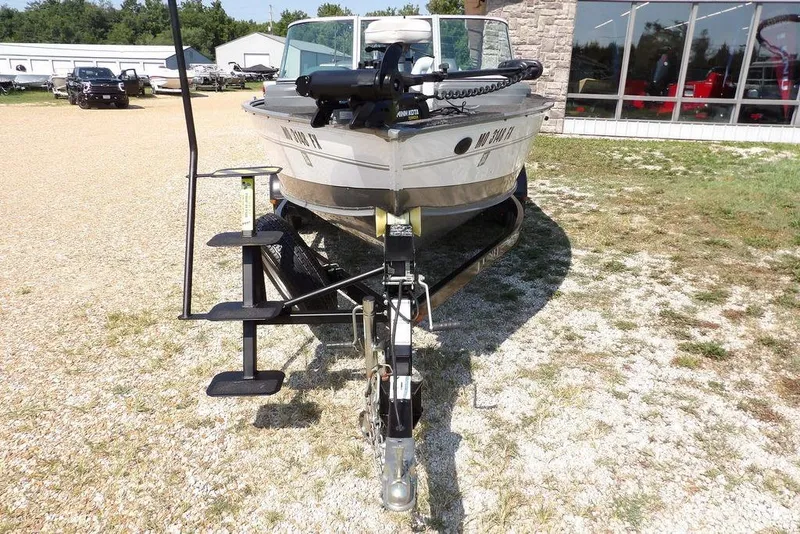 Slide: The Image of 2012 Lund 1775 Impact Sport boat on trailer, parked outdoors. - 3