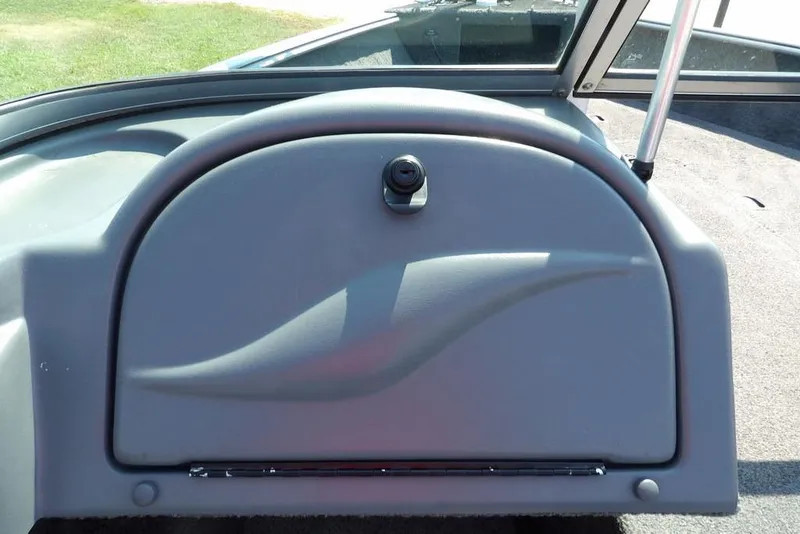 Slide: The Image of Dashboard of a 2012 Lund 1775 Impact Sport boat, featuring a sleek design. - 33