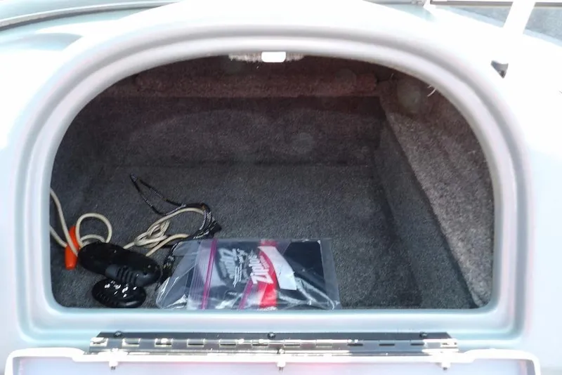 Slide: The Image of Open storage compartment of a 2012 Lund 1775 Impact Sport boat. - 36