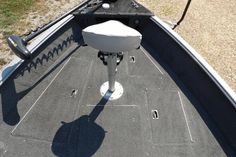 Slide: The Image of 2012 Lund 1775 Impact Sport boat interior with swivel seat and trolling motor. - 45