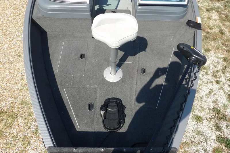 Slide: The Image of 2012 Lund 1775 Impact Sport boat interior with seat and trolling motor. - 46