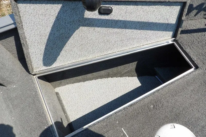 Slide: The Image of Open storage compartment in a 2012 Lund 1775 Impact Sport boat. - 47
