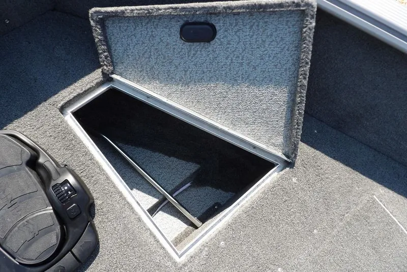 Slide: The Image of Open storage compartment in 2012 Lund 1775 Impact Sport boat interior. - 48