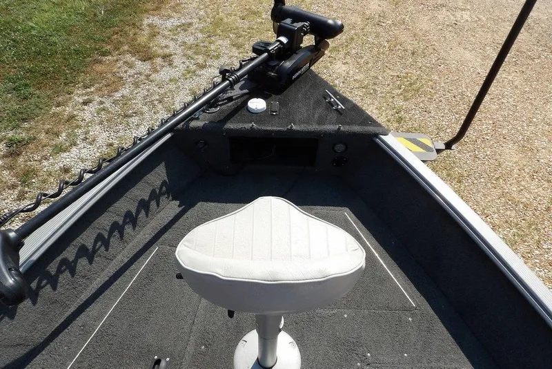 Slide: The Image of 2012 Lund 1775 Impact Sport boat interior with seat and trolling motor. - 52