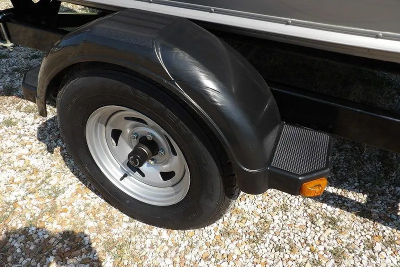 Slide: The Image of Trailer wheel and fender of 2012 Lund 1775 Impact Sport on gravel surface. - 54