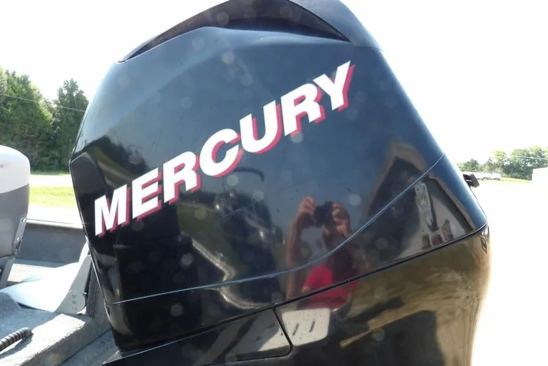 Slide: The Image of Mercury outboard motor on 2012 Lund 1775 Impact Sport boat, outdoors. - 61