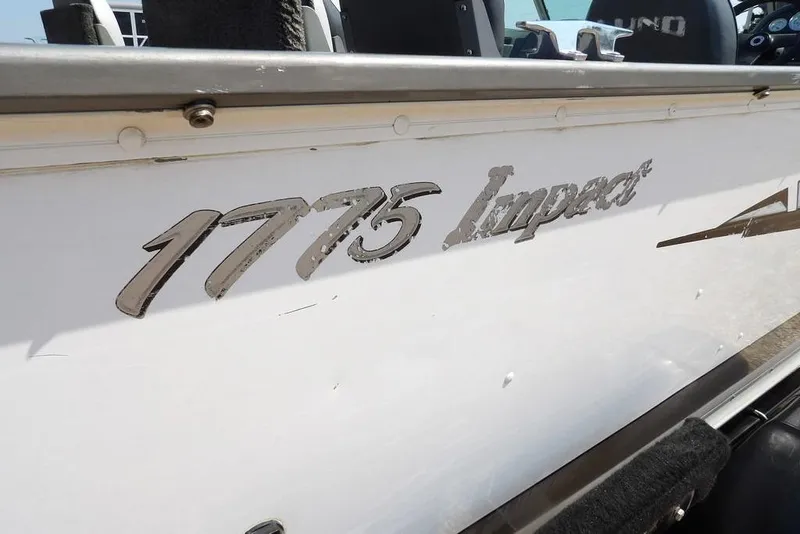 Slide: The Image of 2012 Lund 1775 Impact Sport boat with visible model name on the side. - 63