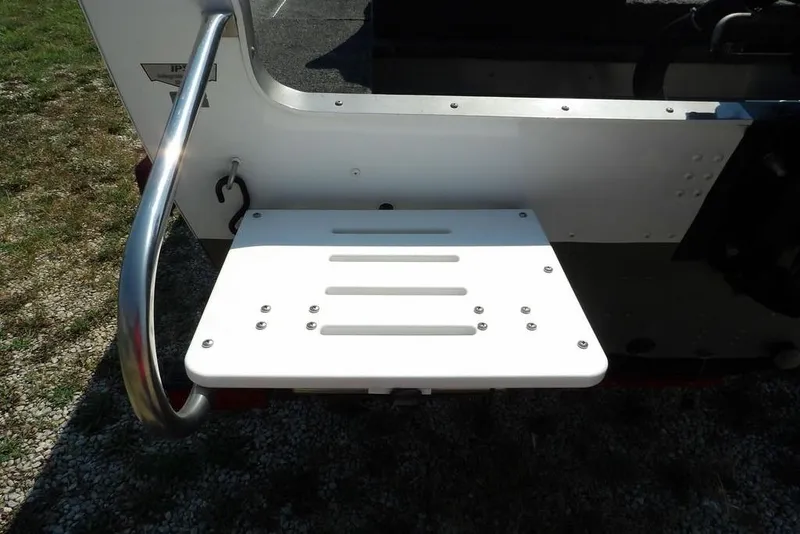 Slide: The Image of 2012 Lund 1775 Impact Sport boat swim platform with stainless steel railing. - 65