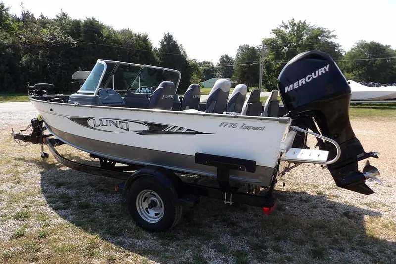 Slide: The Image of 2012 Lund 1775 Impact Sport boat with Mercury outboard motor on a trailer. - 9