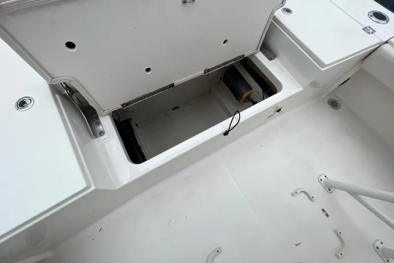Slide: The Image of Open storage compartment on 2016 Robalo 246 Cayman boat deck. - 13
