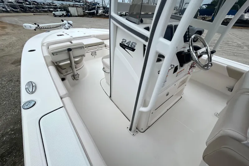 Slide: The Image of 2016 Robalo 246 Cayman boat interior with steering console and seating. - 23