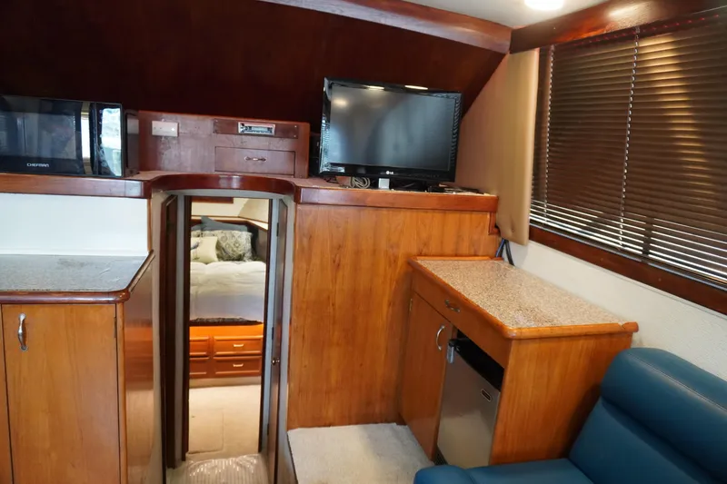 Slide: The Image of Interior of 1986 Ocean Yachts 38 Super Sport with wood cabinetry and modern amenities. - 15
