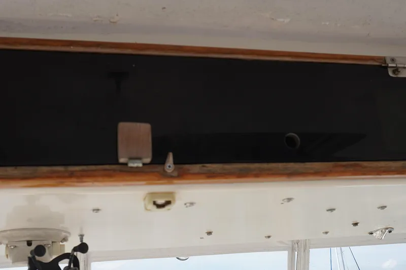 Slide: The Image of Interior detail of a 1986 Ocean Yachts 38 Super Sport boat, featuring wooden trim. - 21