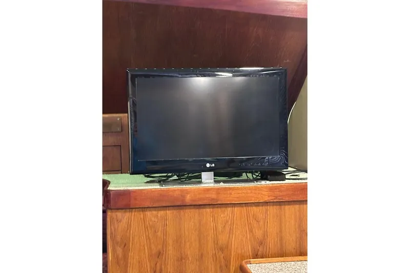 Slide: The Image of LG TV inside 1986 Ocean Yachts 38 Super Sport, wooden interior. - 12