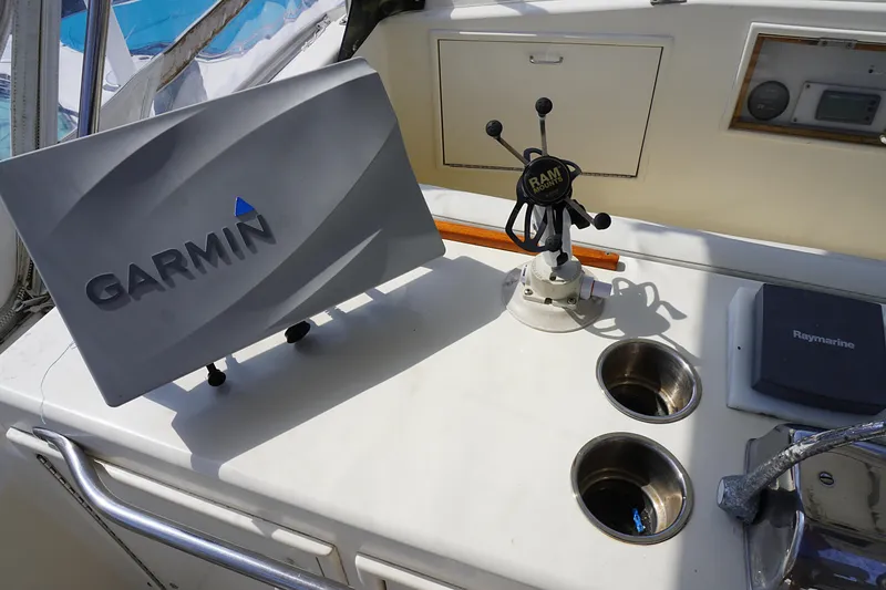 Slide: The Image of 1986 Ocean Yachts 38 Super Sport cockpit with Garmin and Raymarine equipment. - 18