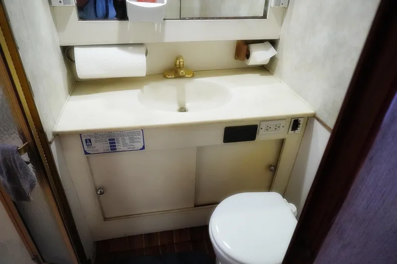 Slide: The Image of Bathroom interior of 1986 Ocean Yachts 38 Super Sport with sink and toilet. - 27