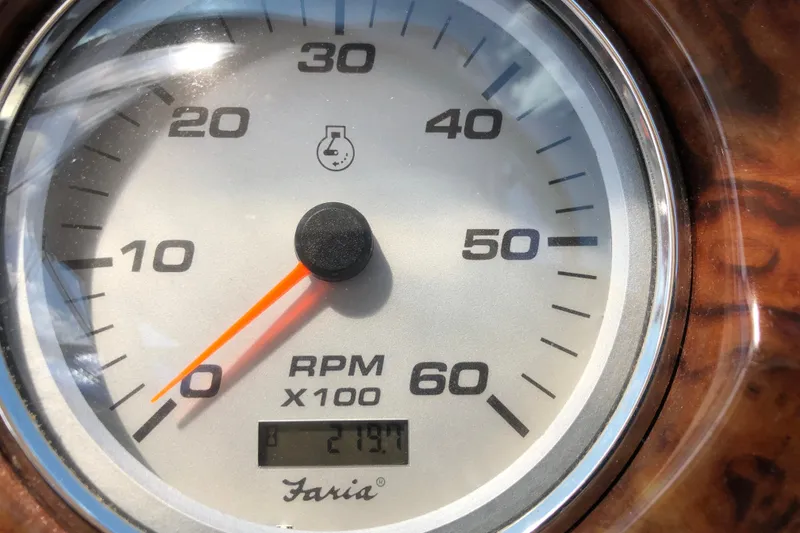Slide: The Image of Close-up of a 2004 Rinker Fiesta Vee 312 RPM gauge, showing 219.4 hours. - 16