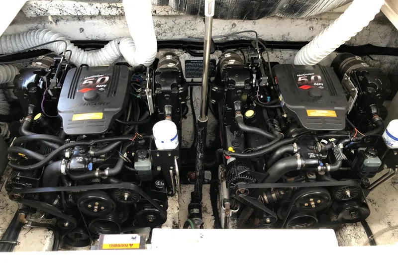 Slide: The Image of Twin MerCruiser engines in a 2004 Rinker Fiesta Vee 312 boat engine compartment. - 26
