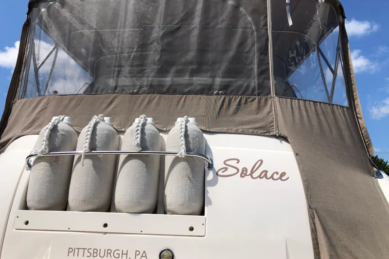 Slide: The Image of 2004 Rinker Fiesta Vee 312 boat named "Solace" with protective covers, Pittsburgh, PA. - 8