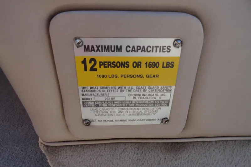 Slide: The Image of Maximum capacity label on 2000 Crownline 202 BR LPX boat, 12 persons or 1690 lbs. - 12