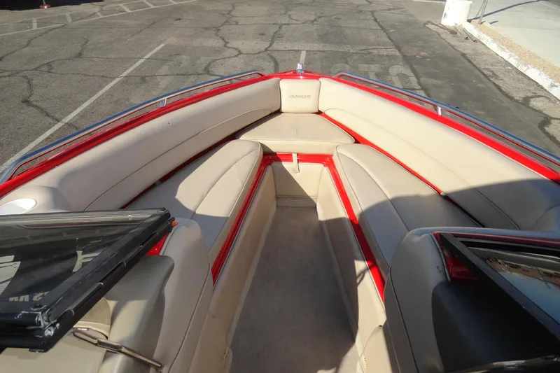Slide: The Image of Interior of 2000 Crownline 202 BR LPX boat with beige seating and red trim. - 14