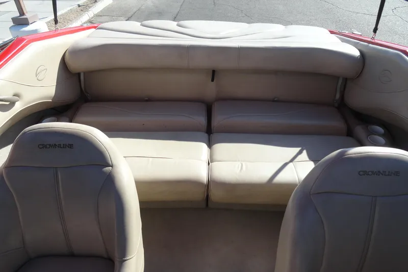 Slide: The Image of Interior of a 2000 Crownline 202 BR LPX boat with beige seating. - 16