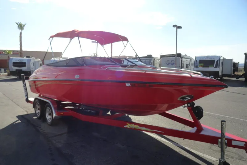 Slide: The Image of Red 2000 Crownline 202 BR LPX boat on trailer, parked outdoors. - 3