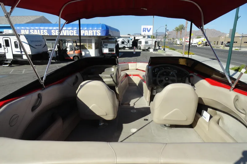 Slide: The Image of Interior view of a 2000 Crownline 202 BR LPX boat at an RV sales lot. - 5