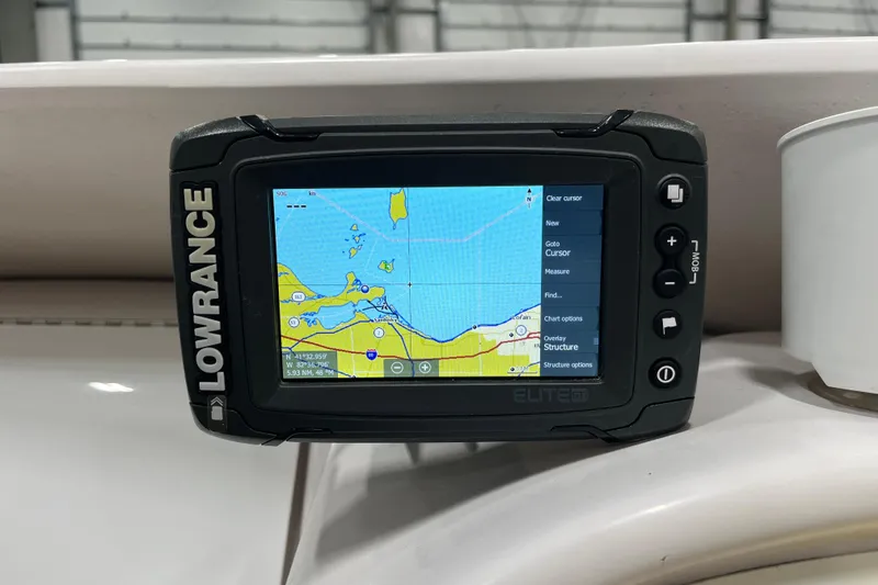Slide: The Image of Lowrance Elite GPS on 1999 Donzi 28 ZX boat, displaying nautical map. - 13