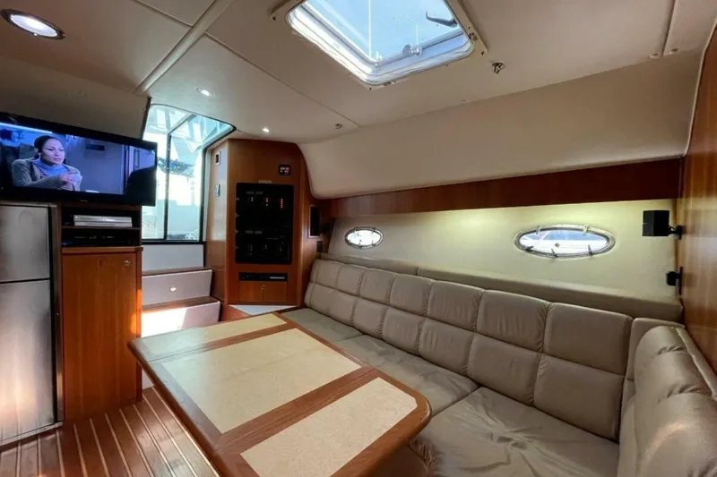 Slide: The Image of Luxurious interior of 2000 Tiara 41 Open yacht with cozy seating and entertainment system. - 11