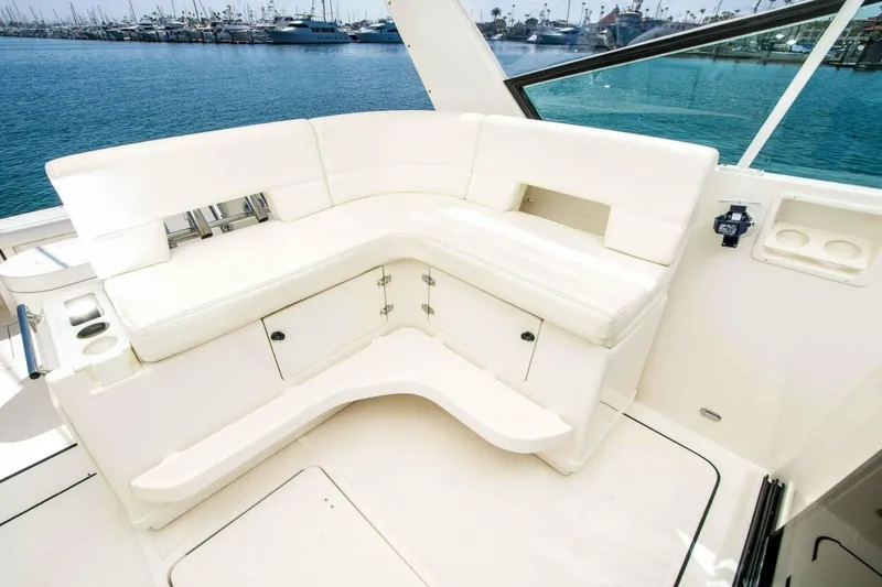 Slide: The Image of Luxurious seating area on a 2000 Tiara 41 Open yacht, overlooking marina. - 23