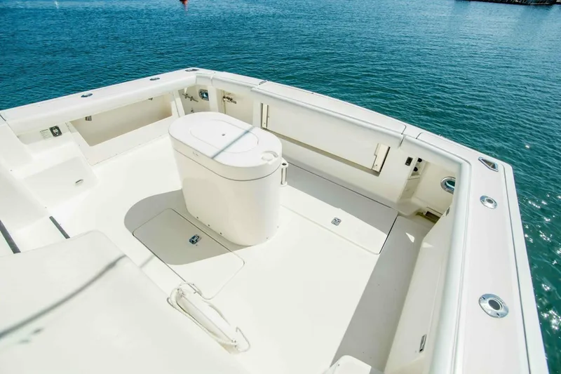 Slide: The Image of 2000 Tiara 41 Open boat deck with seating, surrounded by calm blue water. - 3