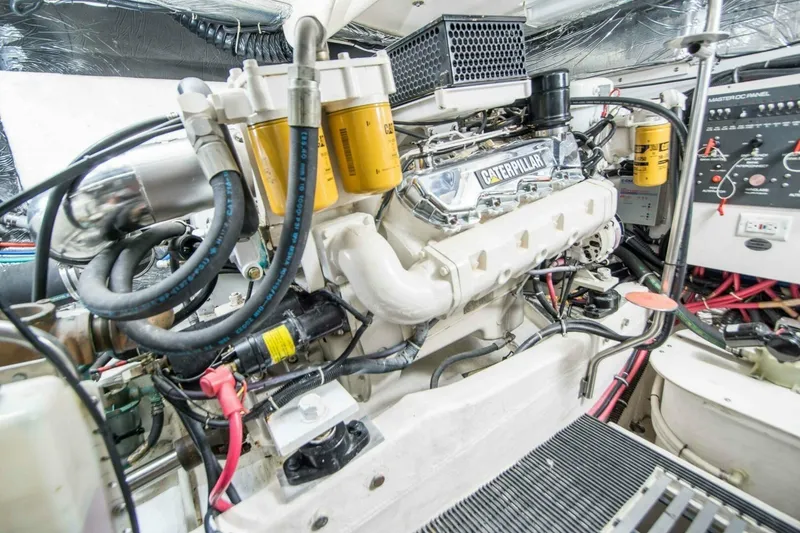 Slide: The Image of Engine room of a 2000 Tiara 41 Open yacht featuring a Caterpillar engine. - 30