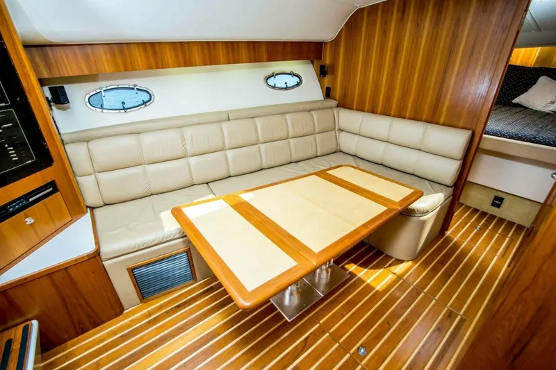 Slide: The Image of Luxurious interior of 2000 Tiara 41 Open yacht with leather seating and wooden accents. - 5