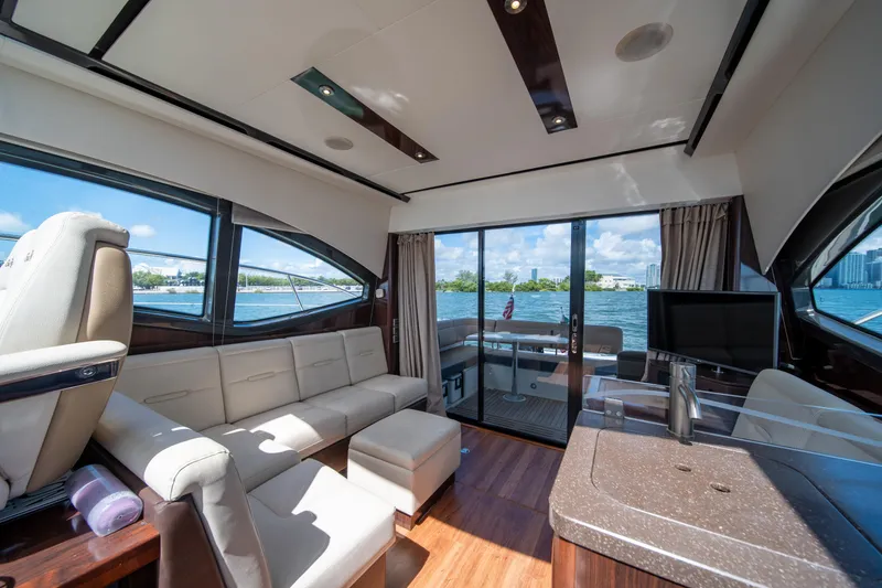 Slide: The Image of Luxurious interior of 2016 Sea Ray 400 Sundancer yacht with waterfront view. - 14