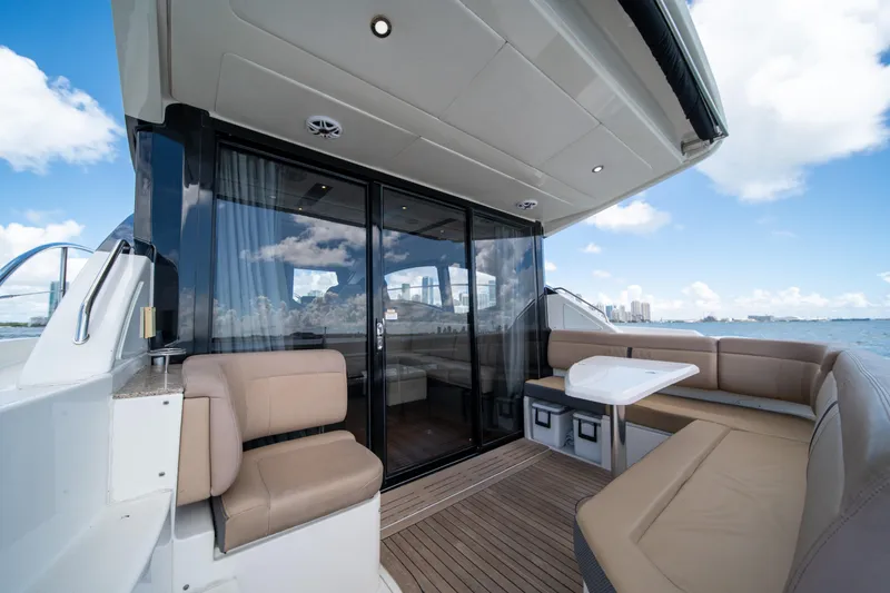 Slide: The Image of Luxurious 2016 Sea Ray 400 Sundancer yacht with spacious outdoor seating and ocean view. - 22