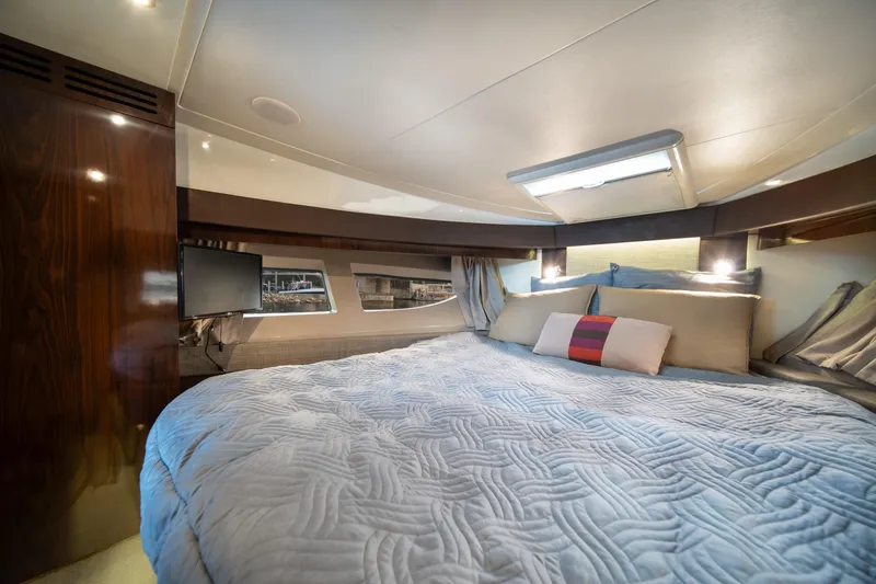 Slide: The Image of Luxurious cabin interior of 2016 Sea Ray 400 Sundancer yacht with cozy bedding. - 26