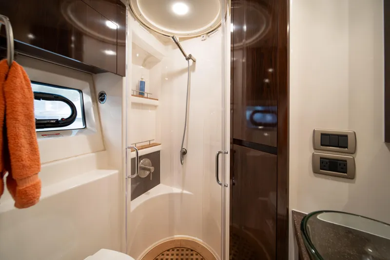 Slide: The Image of Luxurious bathroom in 2016 Sea Ray 400 Sundancer yacht with modern shower and amenities. - 27