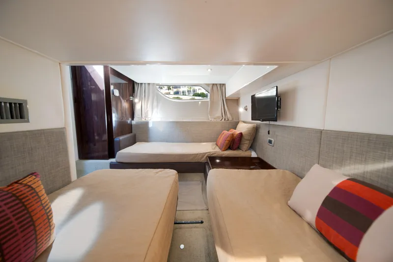 Slide: The Image of Luxurious interior cabin of 2016 Sea Ray 400 Sundancer yacht with twin beds and modern decor. - 31